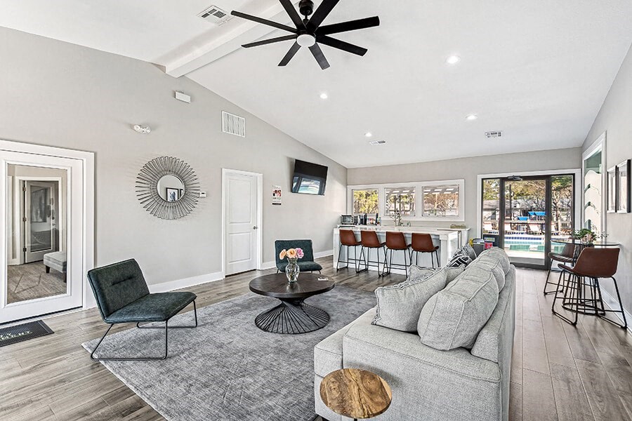 Community Clubhouse with Lounge Furniture and Kitchenette Area at Paramont Apartments in Duluth, GA.