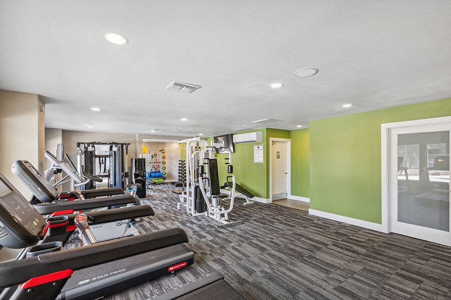 Community Fitness Center with Equipment at Saddle Ridge Apartments in Tucson, AZ.