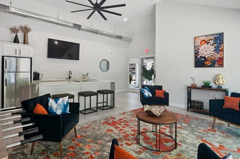 Community Clubhouse with Lounge Furniture and Kitchenette Area at Overlook Apartments located in Salt Lake City, UT.