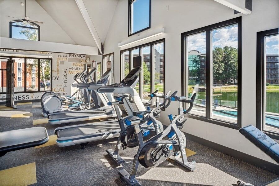 Fitness center with large windows at Esprit Cherry Creek, Glendale Colorado