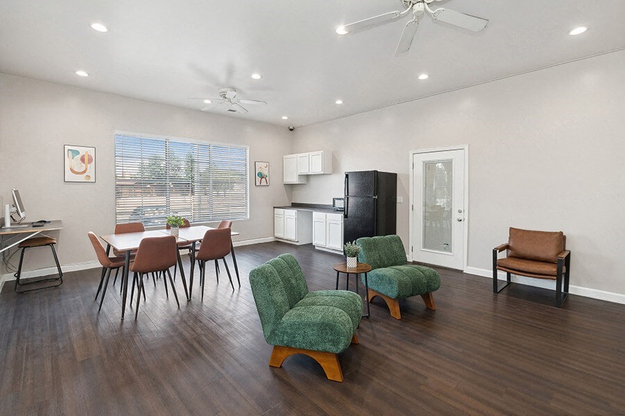 Community Clubhouse with Lounge Furniture and Kitchenette Area at Indigo Park Apartments located in Albuquerque, NM.