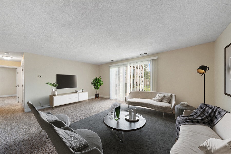 Model Living Room with Carpet and Patio Accessibility at Meadows at Marlborough Apartments in Boston, MA.