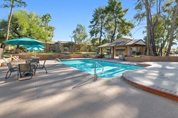Swimming pool and sundeck with tables