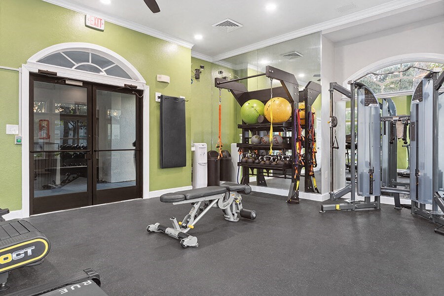 Community Fitness Center with Equipment at Vinings at Hunter's Green Apartments in Tampa, FL.