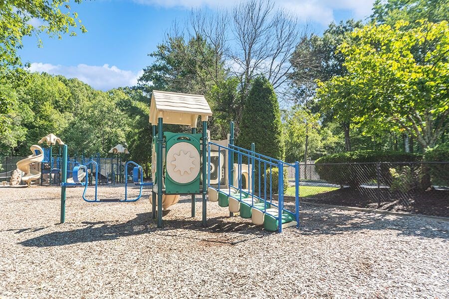 Community Playground with Slide at The Commons at Haynes Farm Apartments in Boston, MA.