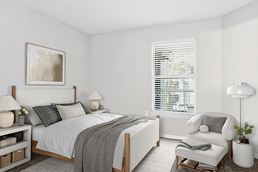 Model Bedroom with Carpet and Window View at Retreat at Crosstown Apartments in Riverview, FL.