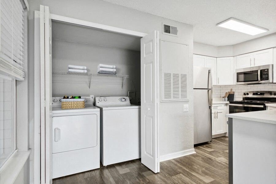 Model laundry closet near kitchen
