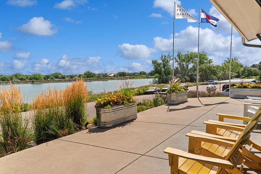 Community Patio Area with view of Lake at Waterfront Apartments in Lakewood, CO.