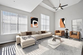 Model living room showcasing large windows - Photo Gallery 2