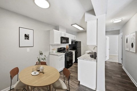 a kitchen and dining room with a table
