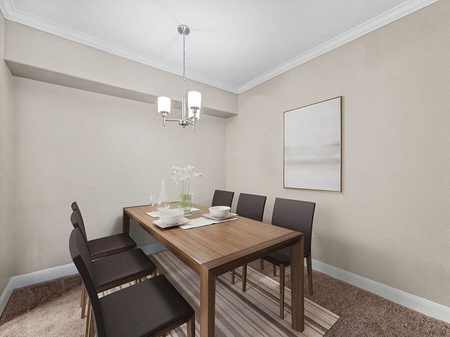 Model Dining Room with Carpet at Park West Apartments located in Houston, TX.