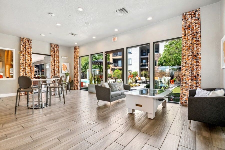 Community Clubhouse with Game Tables at Harmony at Surprise Apartments in Surprise, AZ.
