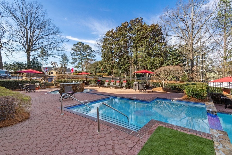 Community pool and custom paver sundeck