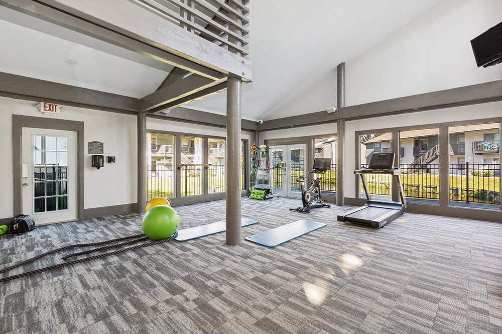 Community Fitness Center with Equipment at Seven Lakes at Carrollwood Apartments in Tampa, FL.