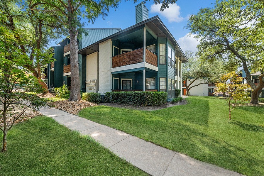 Exterior Community Building and Landscape at Bridges at Deer Run Apartments in Dallas, TX.