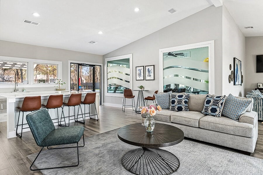 Community Clubhouse with Lounge Furniture and Kitchenette Area at Paramont Apartments in Duluth, GA.