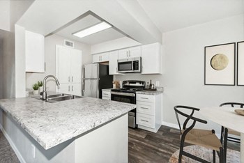 Model kitchen with white cabinetry - Photo Gallery 3
