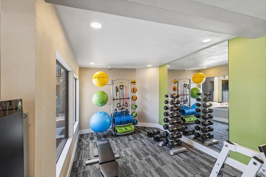 Community Fitness Center with Equipment at Saddle Ridge Apartments in Tucson, AZ.
