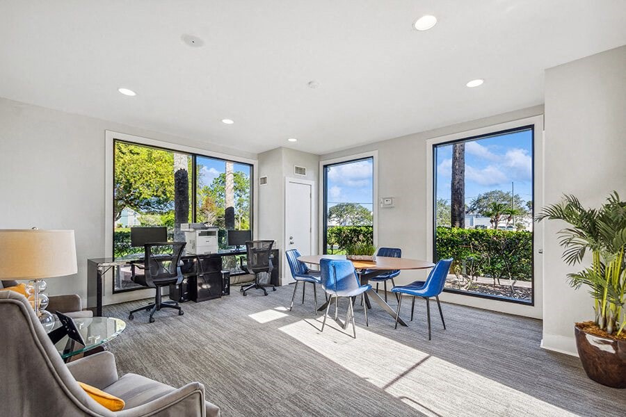 Community Leasing Office with Workstation Area at Bridges at Bayside Apartments in St. Petersburg, FL.