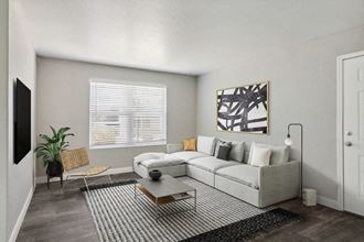 Model living room with a couch and a coffee table