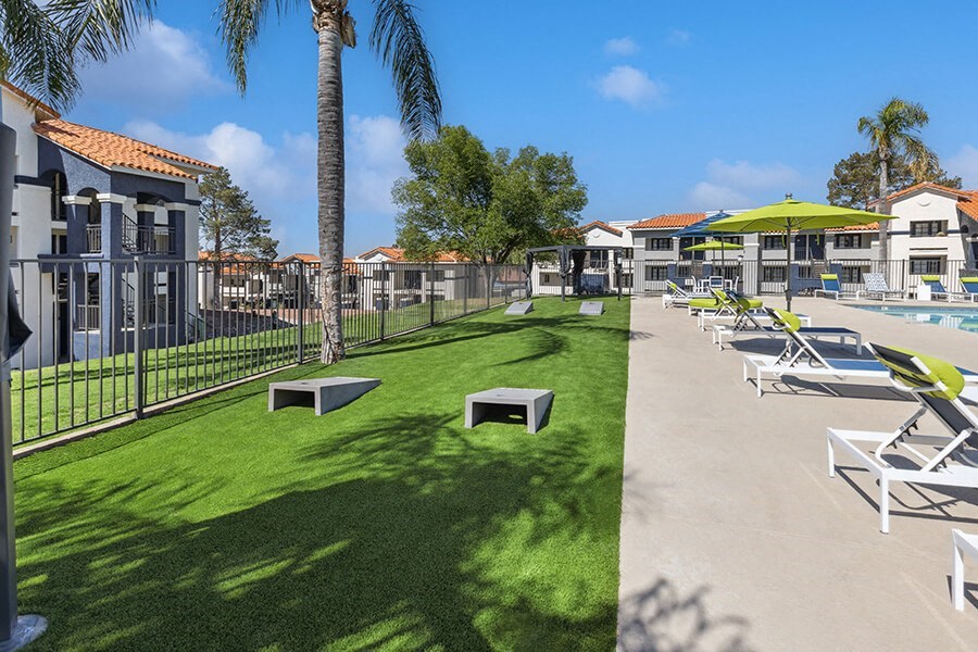 Outdoor Corn Hole Area at Hilands Apartments in Tucson, AZ.