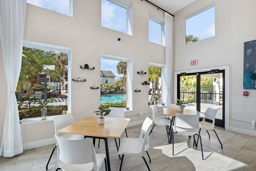 Community Clubhouse with Lounge Furniture at Rosehill Preserve Apartments in Orlando, FL.