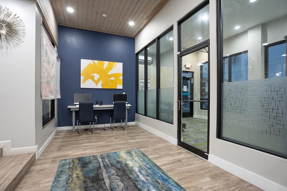 Community Clubhouse Work Station Area at Haven at Water's Edge Apartments in Tampa, FL.