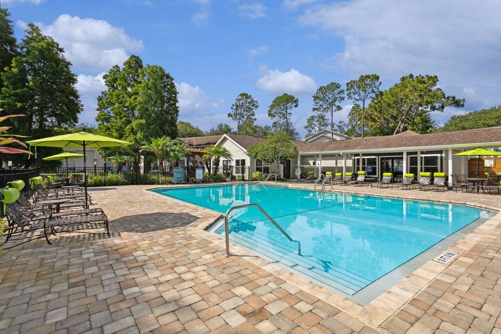 Sparkling swimming pool and pool deck at Retreat at Crosstown Apartments
