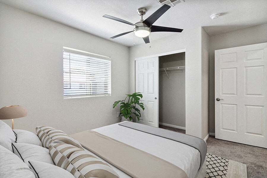 Model Bedroom with Carpet, Closet & Window View at Loma Vista Apartments in Las Vegas, NV.