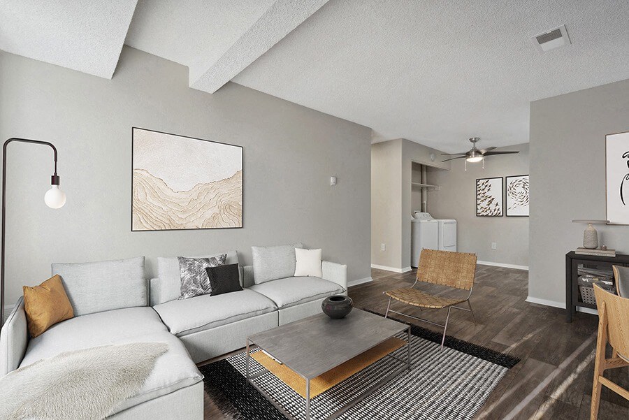Model Living Room with Wood-Style Flooring at Liberty Creek Apartments in Aurora, CO.