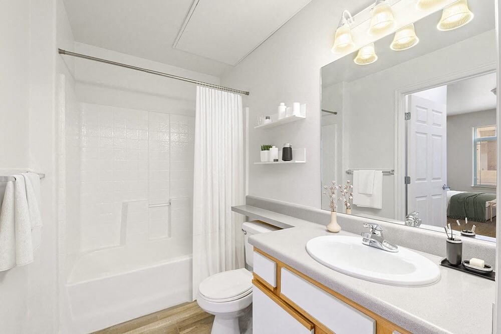 Model Bathroom with Wood-Style Flooring and Shower/Tub at Altitude on Fifth Apartments in Salt Lake City, UT.
