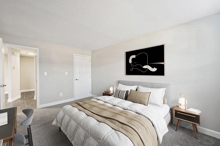 Model Bedroom with Carpet and Hallway View at Middlesex Crossing Apartments in Billerica, MA.