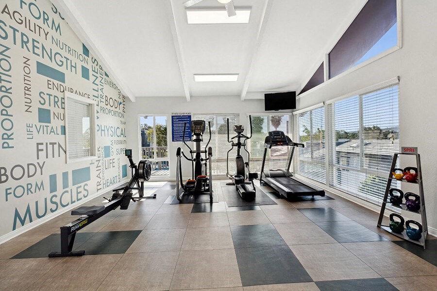 Community Fitness Center with Equipment at Colonnade at Fletcher Hills Apartments in El Cajon, CA.