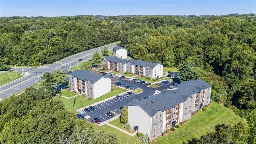 Aerial view of Brightwood Forest Apartments surrounded by trees