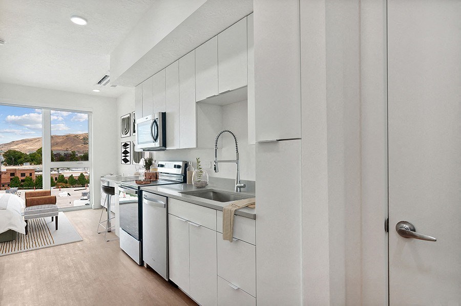 Model kitchen with modern, custom cabinetry at 801 Flats located in Post District Residences in downtown Salt Lake City, Utah