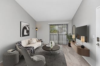 Model Living Room with Carpet and Patio Accessibility at The Meritage Apartments in Vallejo, CA.