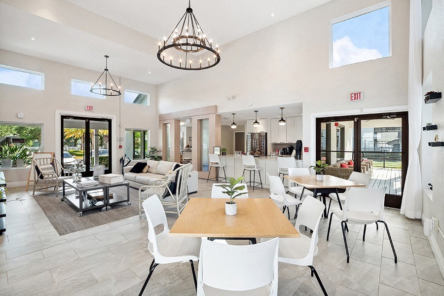 Community Clubhouse with Lounge Furniture at Rosehill Preserve Apartments in Orlando, FL.