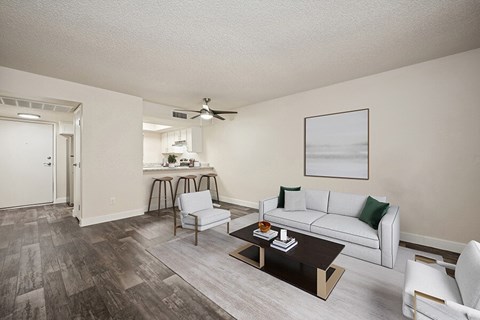 A living room with a white couch and a coffee table.