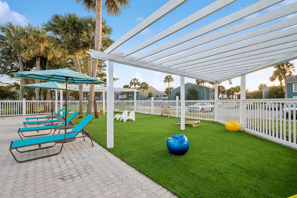 Outdoor Lounge Area with Covered Furniture at Park at 7200 Apartments in Jacksonville, FL.
