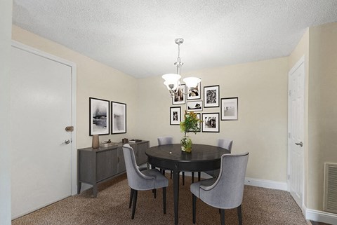 Model Dining Room with Carpet at Meadows at Marlborough Apartments in Boston, MA.