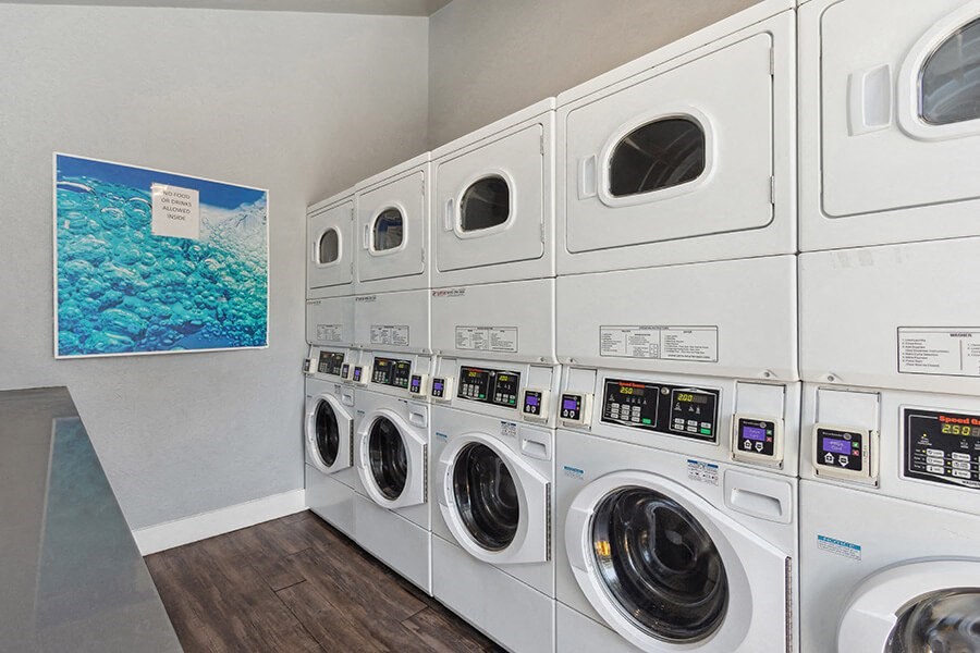 Community Laundry Center with stacked Washing Machines & Dryers at The Archer Apartments in Sacramento, CA.
