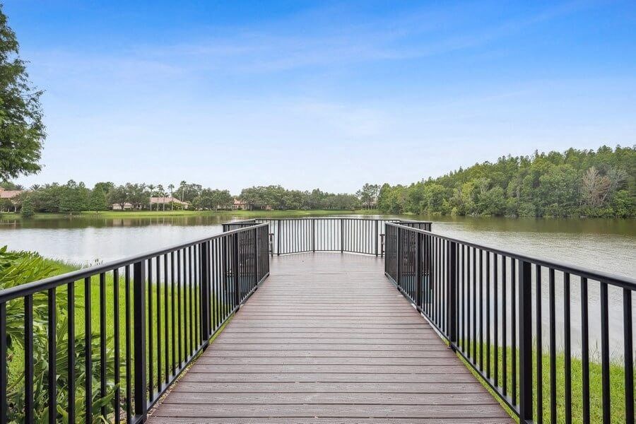 Long wooden dock over pond with look out point