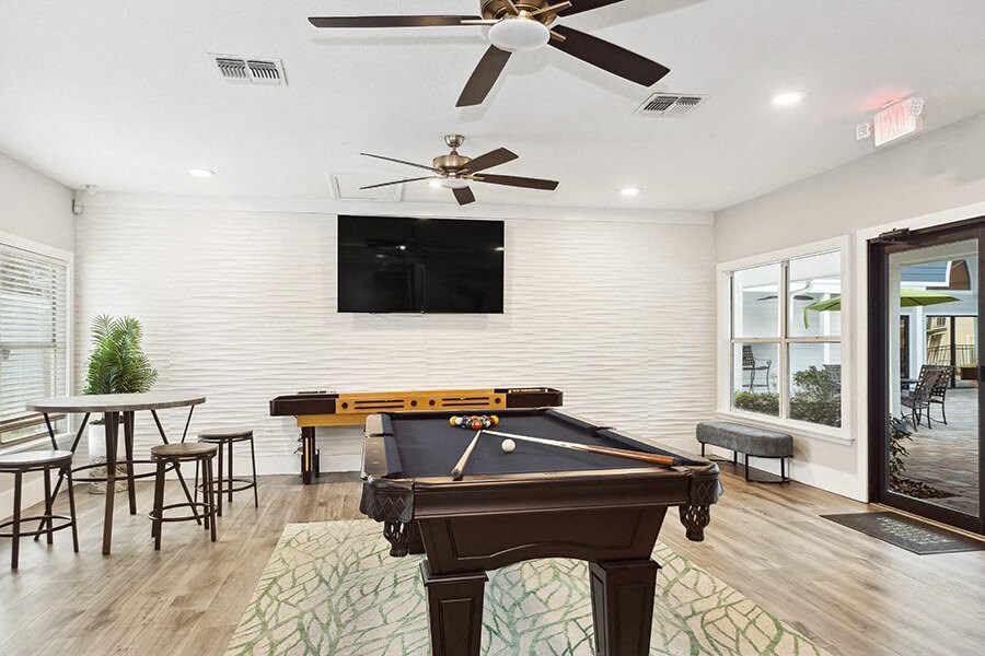 Community Clubhouse with Pool Table Area at Retreat at Crosstown Apartments in Riverview, FL.