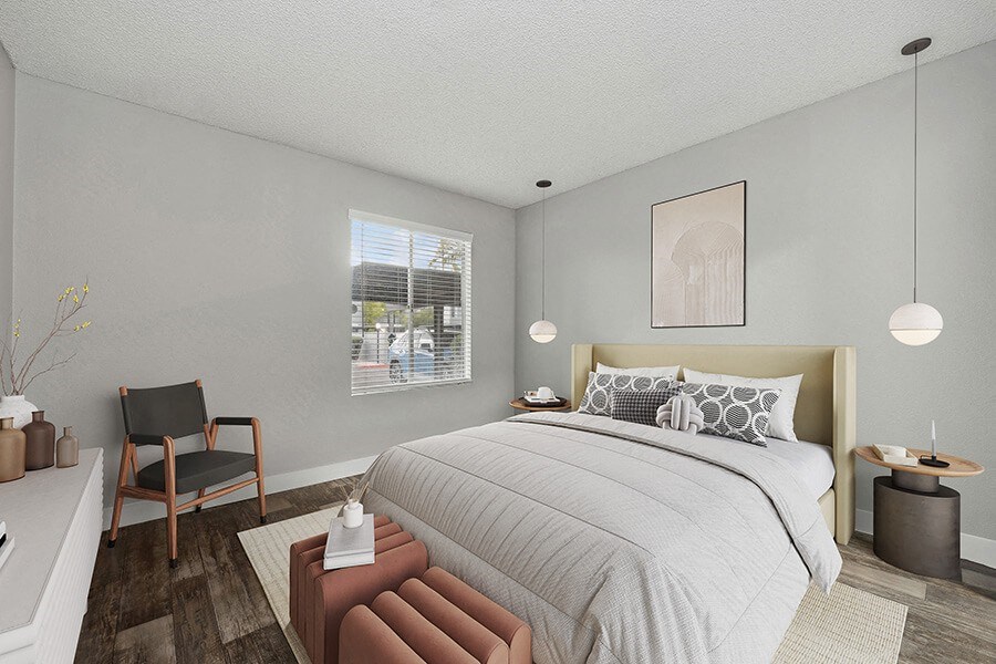 Model Bedroom with Wood-Style Flooring and Window View at Crystal Creek Apartments located in Phoenix, AZ.