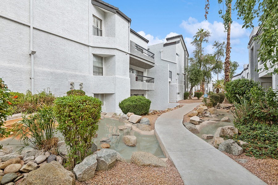 Exterior Community Building and Landscape at Crystal Creek Apartments in Phoenix, AZ.