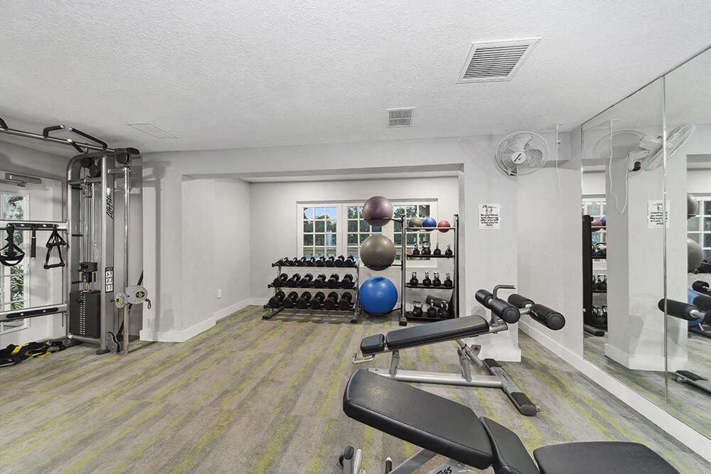 Community Fitness Center with Equipment at Walden Lake Apartments in Plant City, FL.