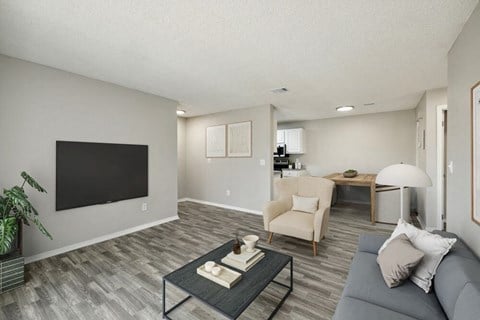 Model apartment living room with view of dining area