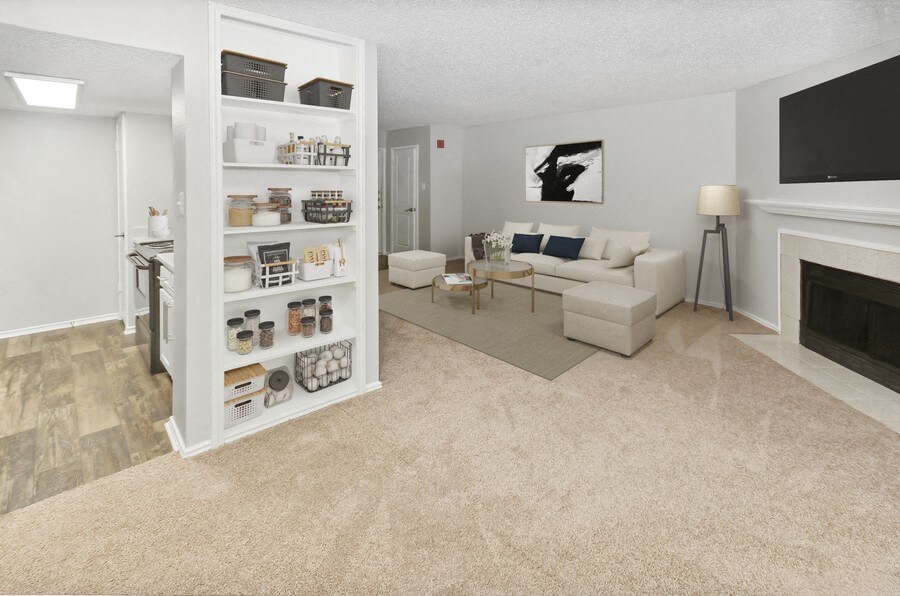 Model living room with tall shelves at Autumnwood, Arlington, 76014