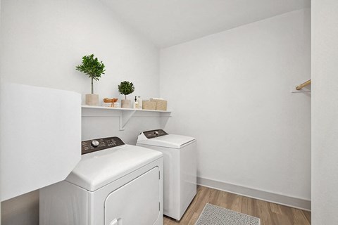 Model Laundry Room with Washer & Dryer at Alta 3Eighty Apartments located in Aubrey, TX.