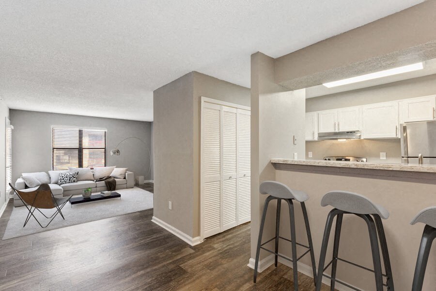 Model dining and kitchen with bar seating